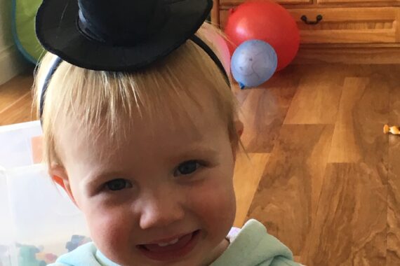 toddler with witches hat