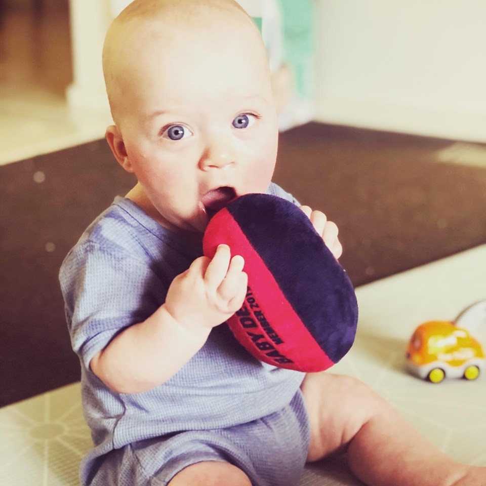 baby with soft ball