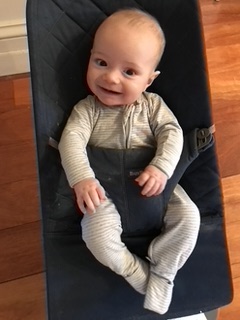 smiling baby in bouncer